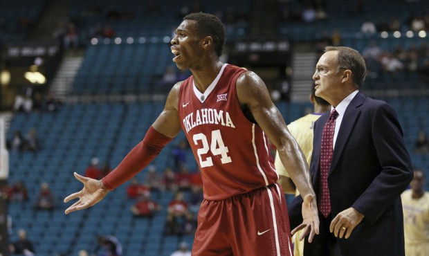 FILE – In this Dec. 20, 2014, file photo, Oklahoma’s Buddy Hield reacts to a call durin...