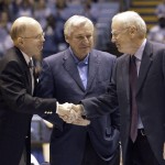 
              FILE - In this Feb. 21, 2004, file photo, former North Carolina coaches Dean Smith, center, and Bill Guthridge, right, shake hands with chancellor James Moeser as they are honored before the start of the Tar Heels' game against Florida State in Chapel Hill, N.C. Bill Guthridge, the longtime assistant to Dean Smith who succeeded him as North Carolina's head coach, has died. He was 77. The school announced Wednesday that Guthridge died Tuesday night, May 12, 2015.(AP Photo/Grant Halverson. File)
            
