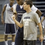 
              In this recent photo provided by the University of Nevada, Nevada coach Eric Musselman directs his players during his first NCAA college basketball practice in Reno, Nev. Musselman learned about running a Division I program from his father and during stops at two schools as an assistant. But once he was named the head coach at Nevada, Musselman found out there's a lot more to the job than he imagined.  (John Byrne, University of Nevada via AP)
            