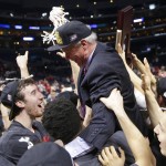 
              FILE - In this Saturday, March 28, 2015 file photo, Wisconsin players lift up head coach Bo Ryan as they celebrate their 85-78 win over Arizona in a college basketball regional final to advance to the Final Four in the NCAA Tournament in Los Angeles. Ryan said on Monday, June 29, that he will retire after one more season with the Badgers. (AP Photo/Jae C. Hong, File)
            