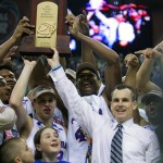 
              FILE - In this Apri 2, 2007, file photo, Florida coach Billy Donovan, right,  holds up the championship trophy after the defeated Ohio State 84-75 in the NCAA Final Four college basketball championship at the Georgia Dome in Atlanta. Florida has the tough task of replacing Donovan, who spent nearly two decades putting the football-first program on the college basketball map. He left the school last week to become the new coach of the Oklahoma City Thunder. (AP Photo/Gerry Broome, File)
            
