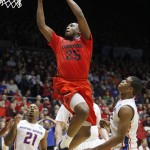 
              FILE- In this March 18, 2015, file photo, Dayton's Kendall Pollard (25) shoots against Boise State in the first half of a first round NCAA tournament basketball game in Dayton, Ohio. The NCAA announced Monday, July 20, 2015, that the Division I selection committee will now be allowed to slide every team up or down the seed list, including the last four at-large teams selected. Last season, the seeding process placed Dayton into the First Four, playing at home. (AP Photo/Skip Peterson, File)
            