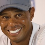 
              Tiger Woods smiles as he answers a question during a news conference prior to the start of the Quicken Loans National golf tournament at the Robert Trent Jones Golf Club in Gainesville, Va., Tuesday, July 28, 2015.  (AP Photo/Steve Helber)
            
