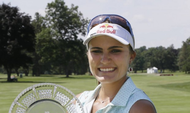 Lexi Thompson holds the trophy after winning the Meijer LPGA Classic golf tournament Sunday, July 2...