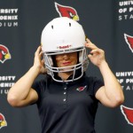 Arizona Cardinals training camp coach Dr. Jen Welter poses for photographers after being introduced, Tuesday, July 28, 2015, at the teams' training facility in Tempe, Ariz. Welter is believed to be the first female to hold a coaching position of any kind in the NFL and will be member of the Cardinals coaching staff throughout training camp and the preseason, working with inside linebackers. (AP Photo/Matt York)