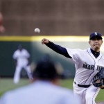 Seattle Mariners starting pitcher Hisashi Iwakuma throws against the Arizona Diamondbacks' A.J. Pollock in the first inning of a baseball game Tuesday, July 28, 2015, in Seattle. (AP Photo/Elaine Thompson)
