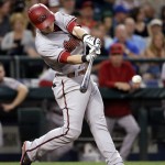 Arizona Diamondbacks' Chris Owings singles in a pair of runs against the Seattle Mariners in the sixth inning of a baseball game, Tuesday, July 28, 2015, in Seattle. (AP Photo/Elaine Thompson)
