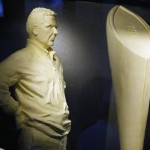               A butter sculpture depicting Ohio State NCAA football coach Urban Meyer, left, and the national championship trophy are displayed in the dairy building at the Ohio State fairgrounds, Tuesday, July 28, 2015, in Columbus, Ohio. The sculptures are joining the traditional butter cow and calf in a 46-degree cooler in the American Dairy Association display. (Kyle Robertson/The Columbus Dispatch via AP)
            